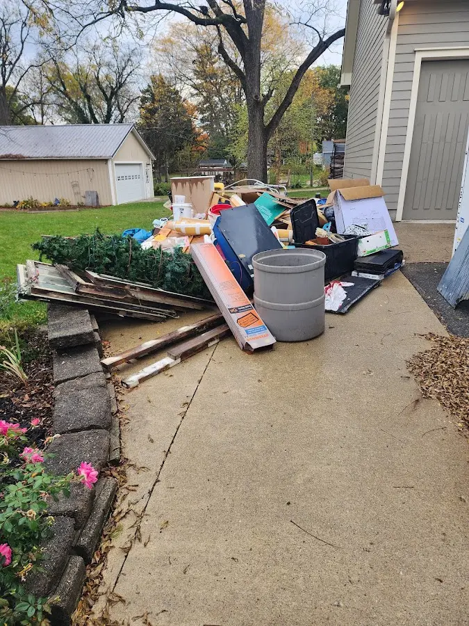 Dumpster being loaded with debris for 3 Yard Dumpster Rental in Hazel Crest